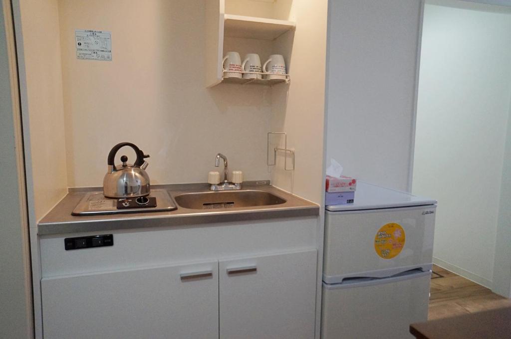 Kuchyň nebo kuchyňský kout v ubytování Osaka Tsuruhashitei Hotel Asahi group 大阪鶴橋亭ホテル