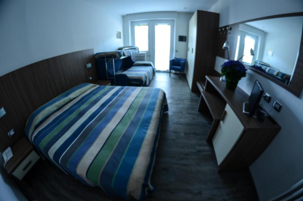 Postel nebo postele na pokoji v ubytování Hotel National