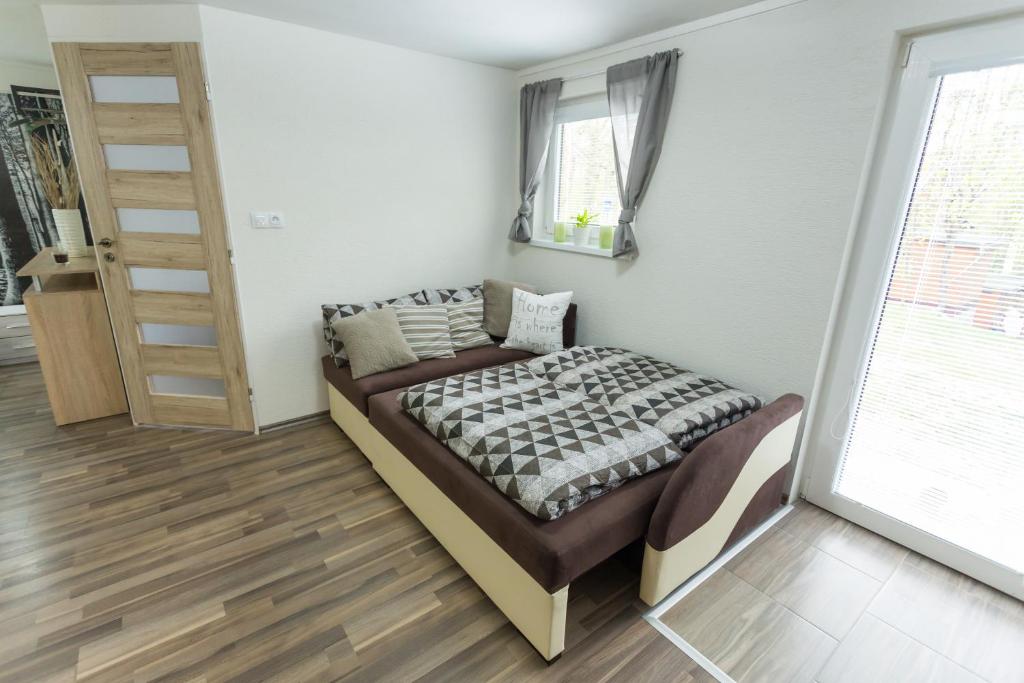 Postel nebo postele na pokoji v ubytování Lesní Penzion Vranov