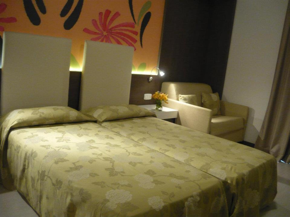 Postel nebo postele na pokoji v ubytování Hotel Lily