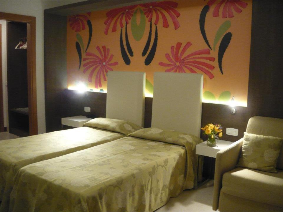 Postel nebo postele na pokoji v ubytování Hotel Lily