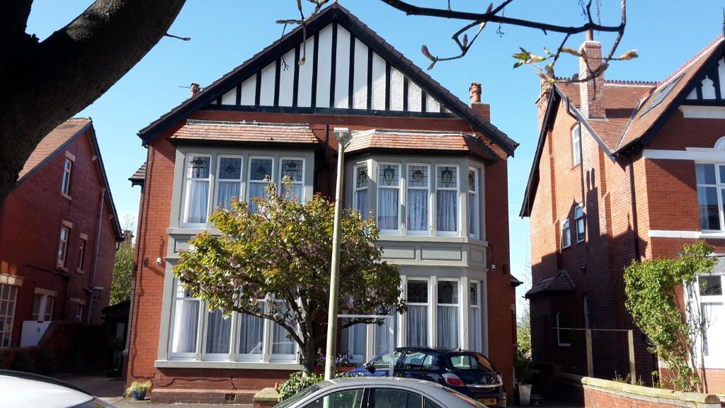 a house with a black and white roof at The Breverton in Lytham St Annes