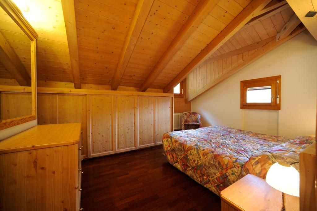 Postel nebo postele na pokoji v ubytování Residence Lagorai - Fiemme Holidays