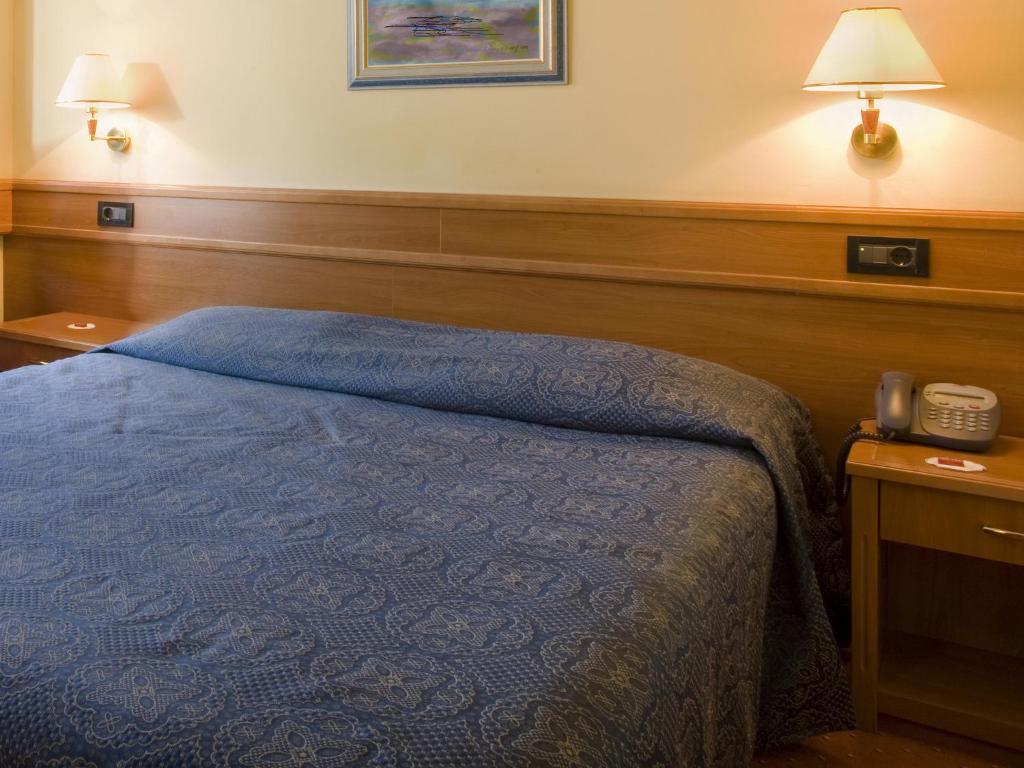 Posteľ alebo postele v izbe v ubytovaní Hotel Kristal - Liburnia