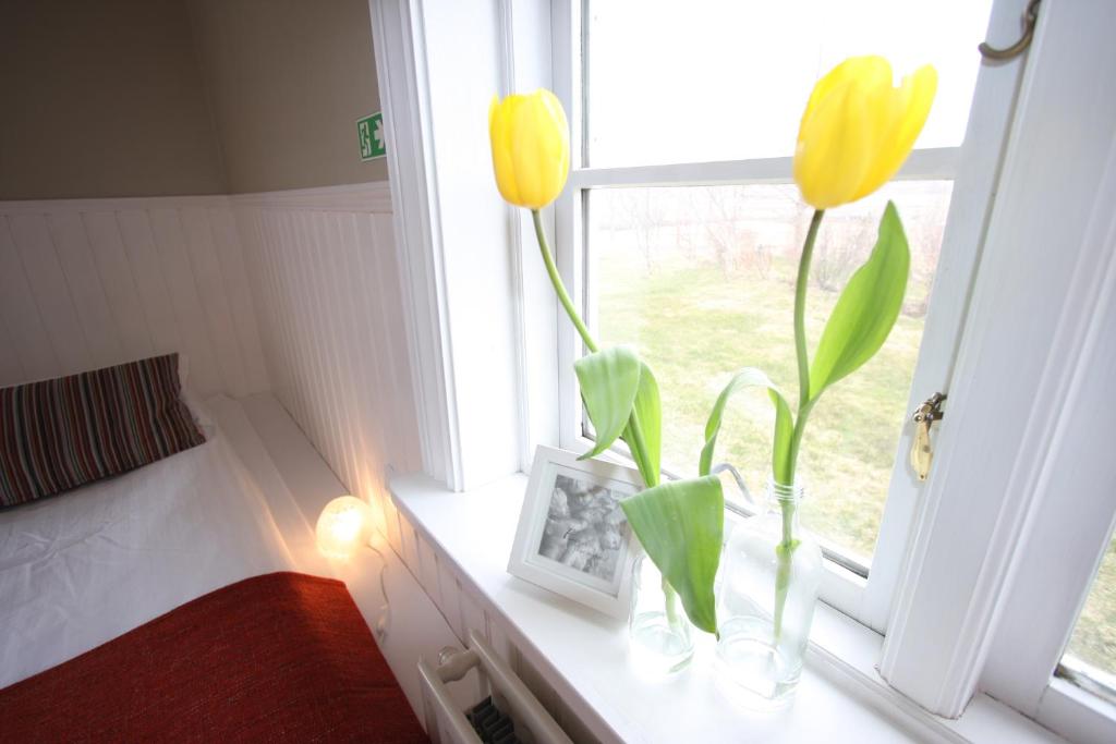 Postel nebo postele na pokoji v ubytování Ásar Guesthouse
