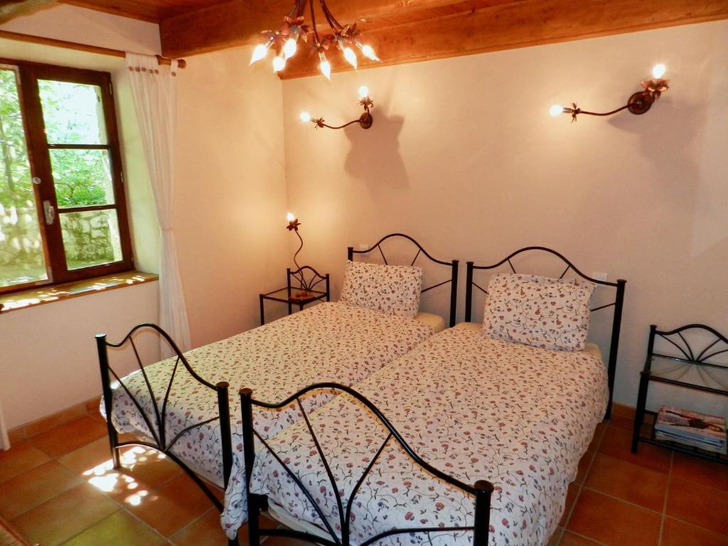 Cama ou camas em um quarto em Le Moulin de Lande