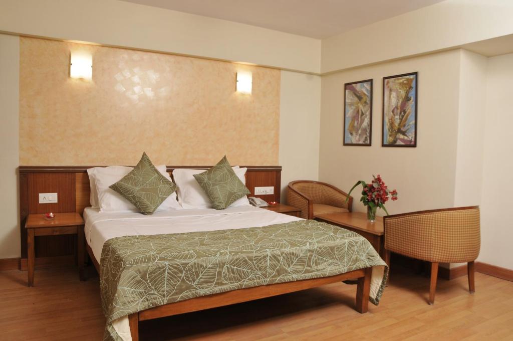 Postel nebo postele na pokoji v ubytování Hotel Abigail Regency
