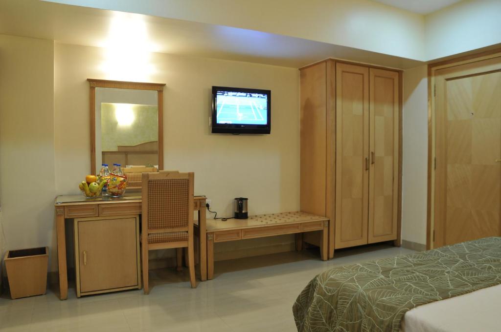Postel nebo postele na pokoji v ubytování Hotel Abigail Regency