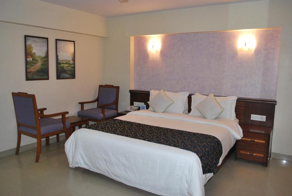 Postel nebo postele na pokoji v ubytování Hotel Abigail Regency