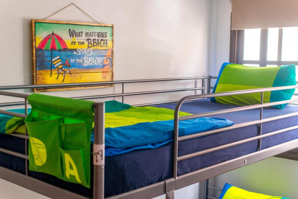 Postel nebo postele na pokoji v ubytování La Tortuga Hostel