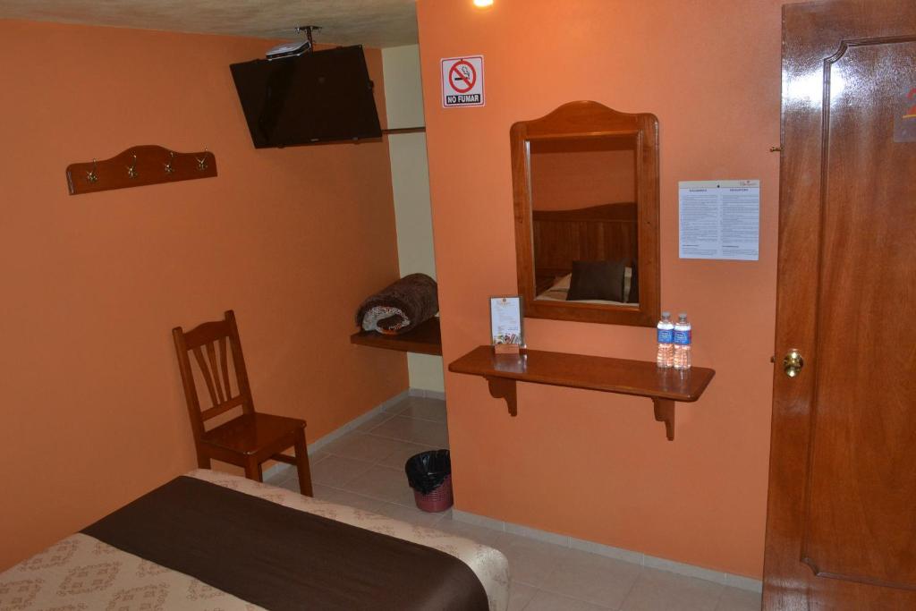 TV a/nebo společenská místnost v ubytování Hotel Márquez