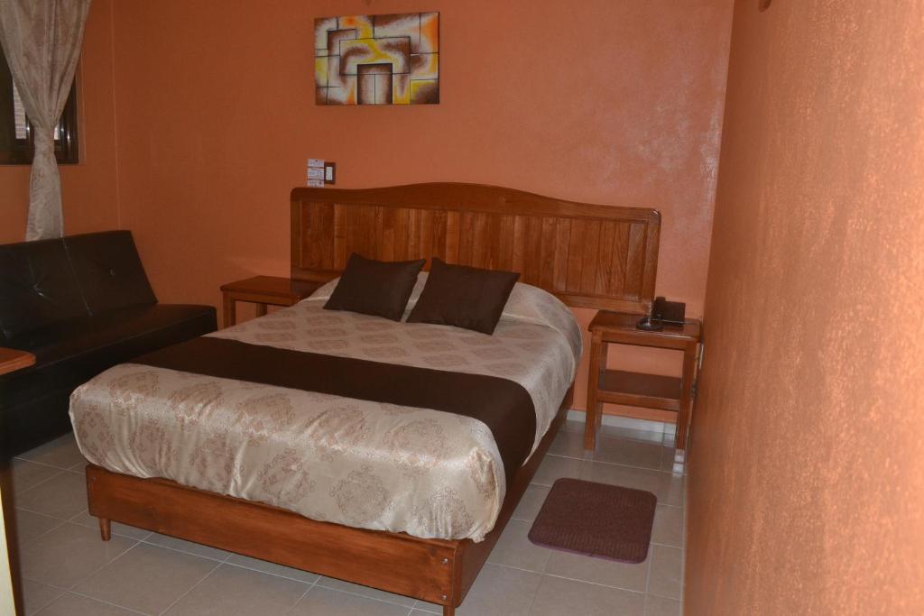 Postel nebo postele na pokoji v ubytování Hotel Márquez