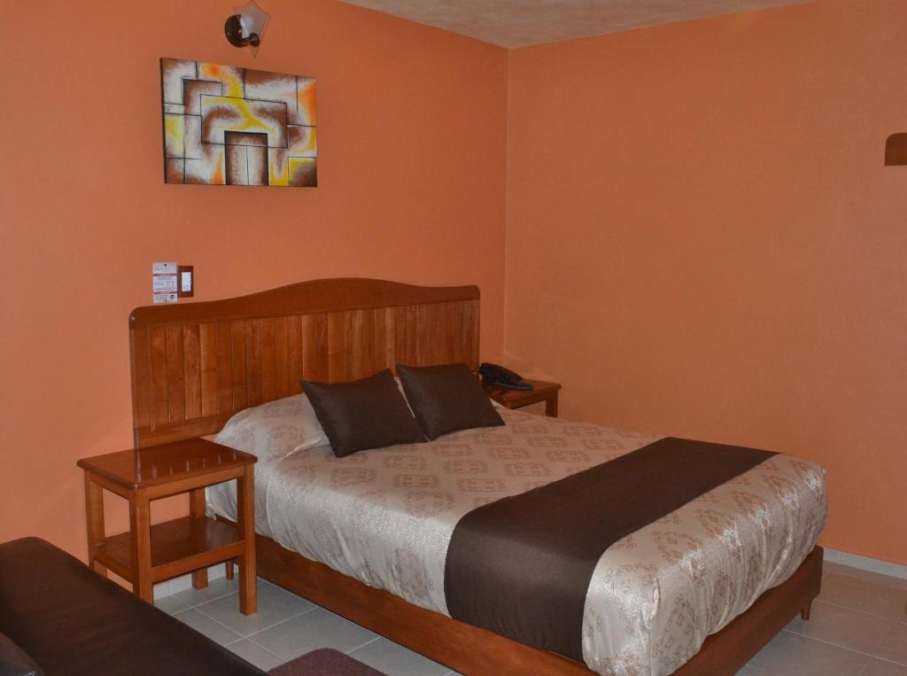 Postel nebo postele na pokoji v ubytování Hotel Márquez