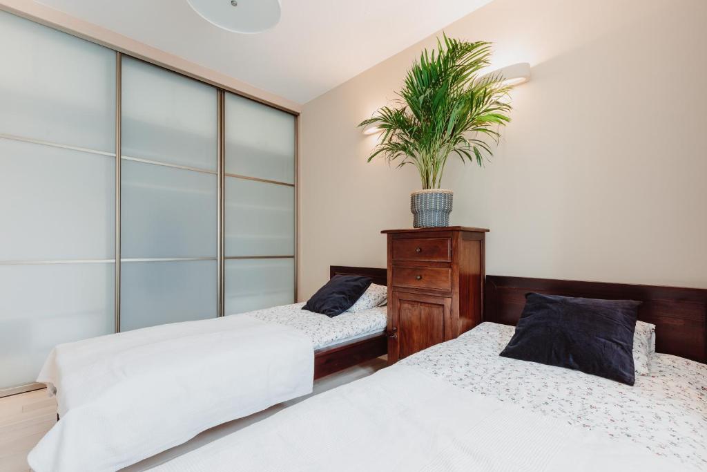 Posteľ alebo postele v izbe v ubytovaní Apartament Wisniowa