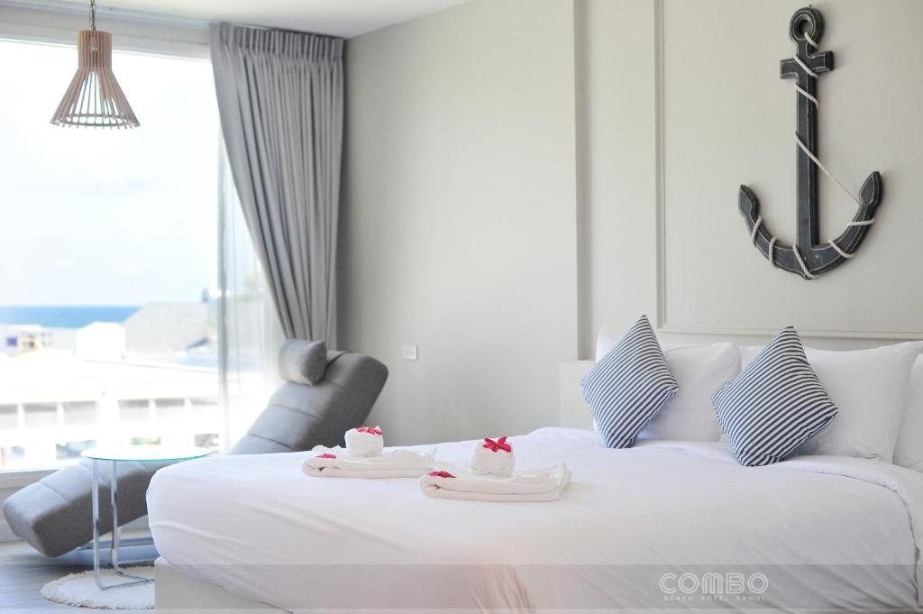 Postel nebo postele na pokoji v ubytování Combo Beach Hotel Samui