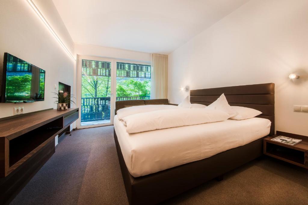 Postel nebo postele na pokoji v ubytování Hotel Braunsbergerhof