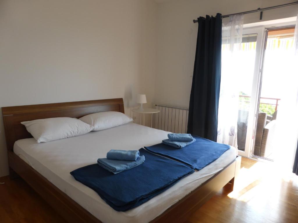Postel nebo postele na pokoji v ubytování Apartments Adria