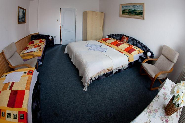 Postel nebo postele na pokoji v ubytování Pension Karst Blansko