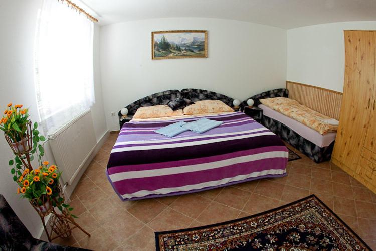 Postel nebo postele na pokoji v ubytování Pension Karst Blansko