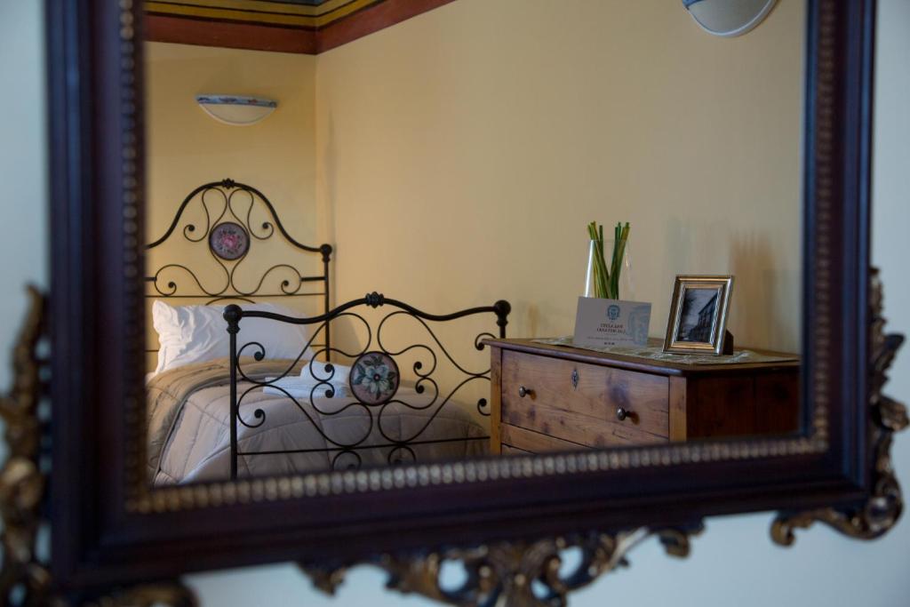 Postel nebo postele na pokoji v ubytování Palazzo Lauritano