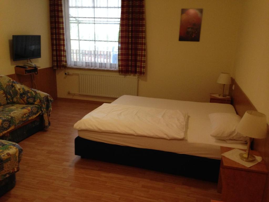 Postel nebo postele na pokoji v ubytování Hotel Sonnenhof