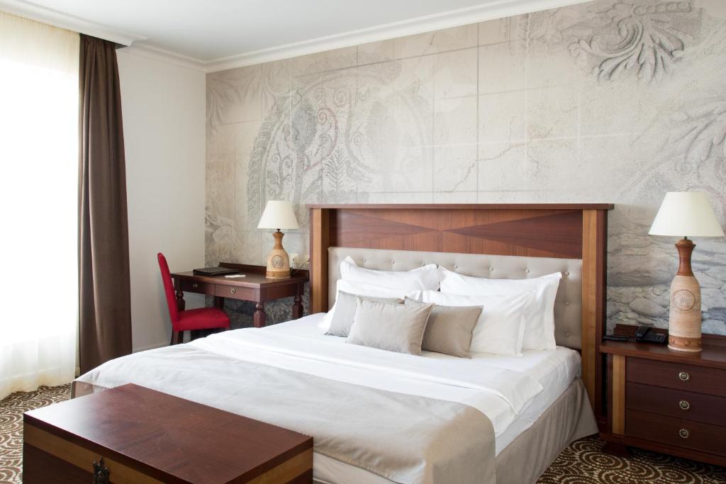 Ένα ή περισσότερα κρεβάτια σε δωμάτιο στο Arena Di Serdica Hotel