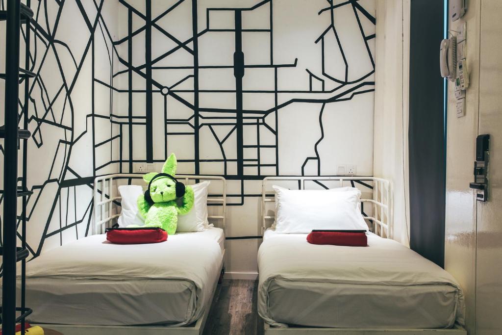 Postel nebo postele na pokoji v ubytování Dash Box Hotel Cyberjaya