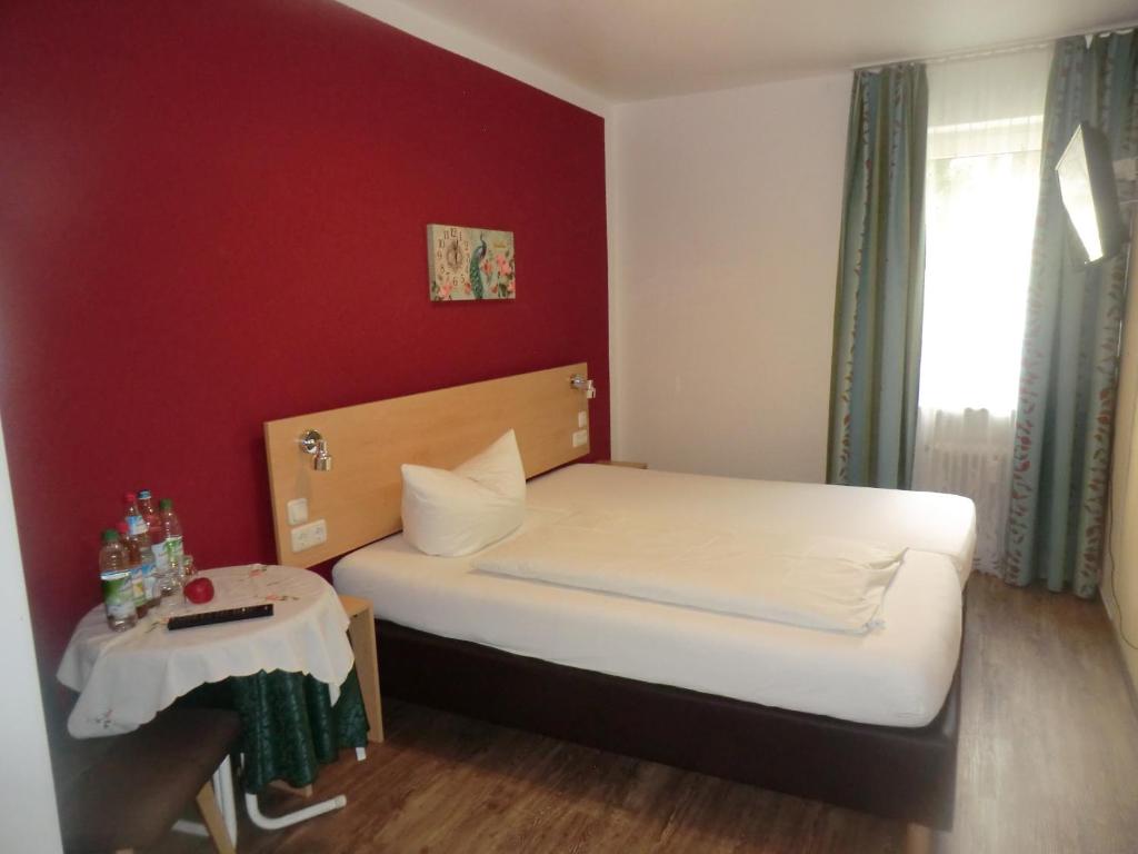 Postel nebo postele na pokoji v ubytování Hotel Pension Haydn