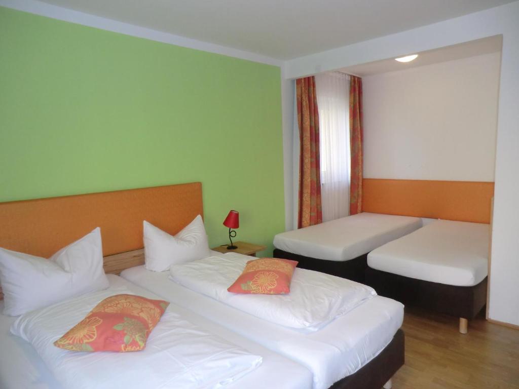 Postel nebo postele na pokoji v ubytování Hotel Pension Haydn