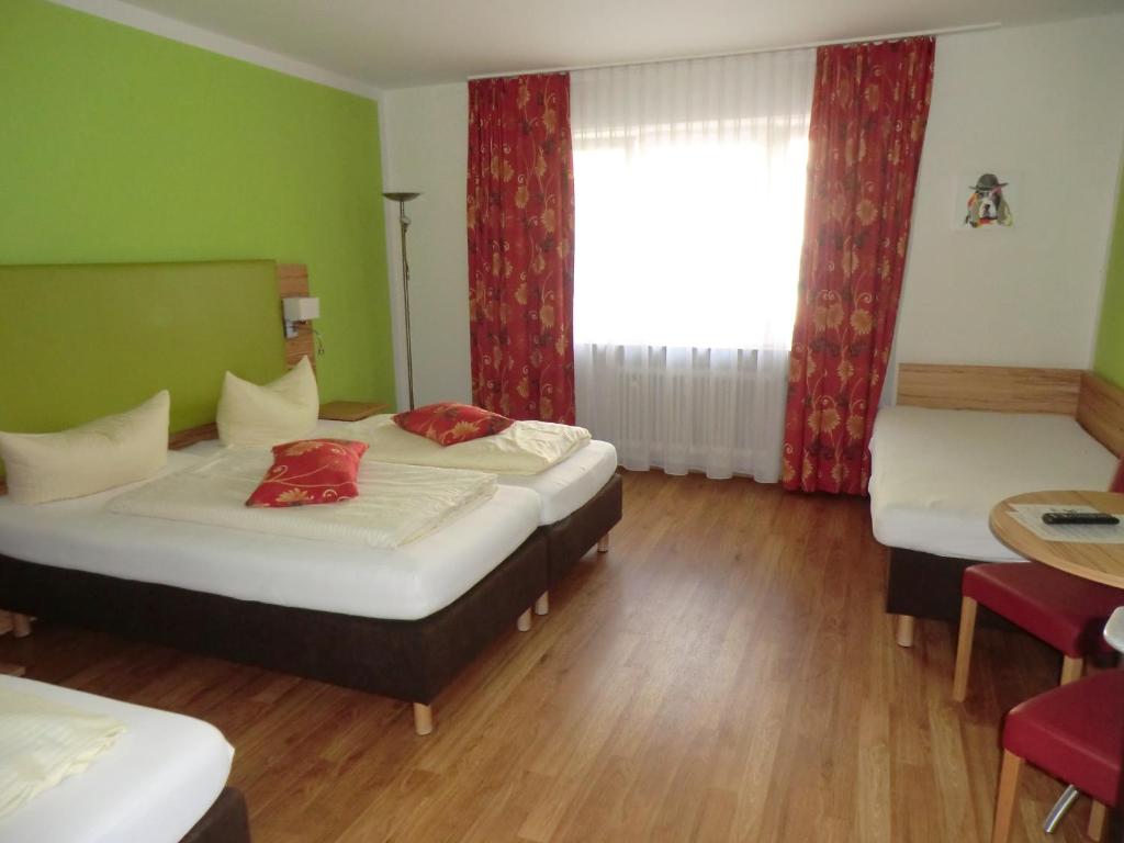Postel nebo postele na pokoji v ubytování Hotel Pension Haydn
