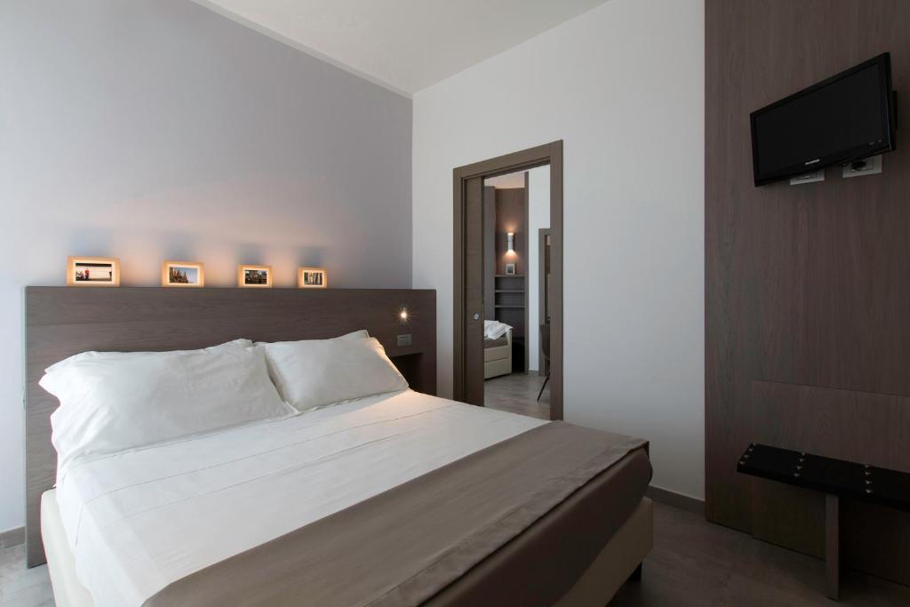 Postel nebo postele na pokoji v ubytování Hotel Eden