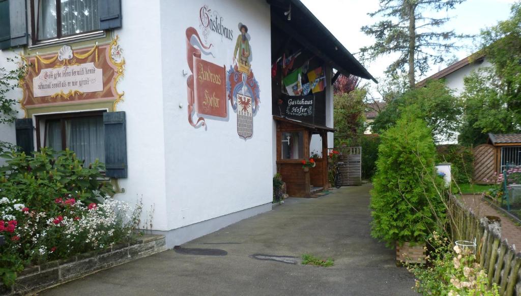 a white building with a sign on the side of it at Gästehaus Andreas Hofer in Garmisch-Partenkirchen