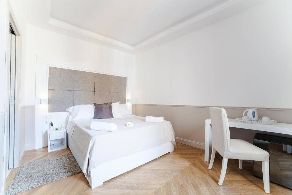 Łóżko lub łóżka w pokoju w obiekcie Margherita Suites