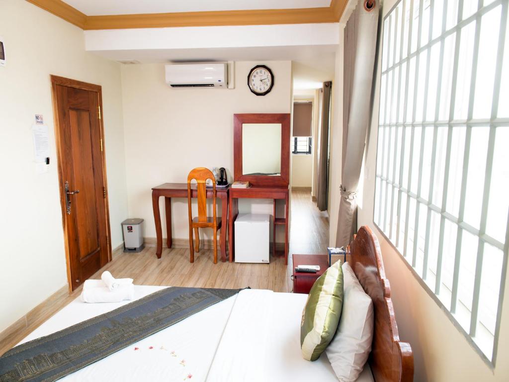 Postel nebo postele na pokoji v ubytování Dynsey Boutique Hotel