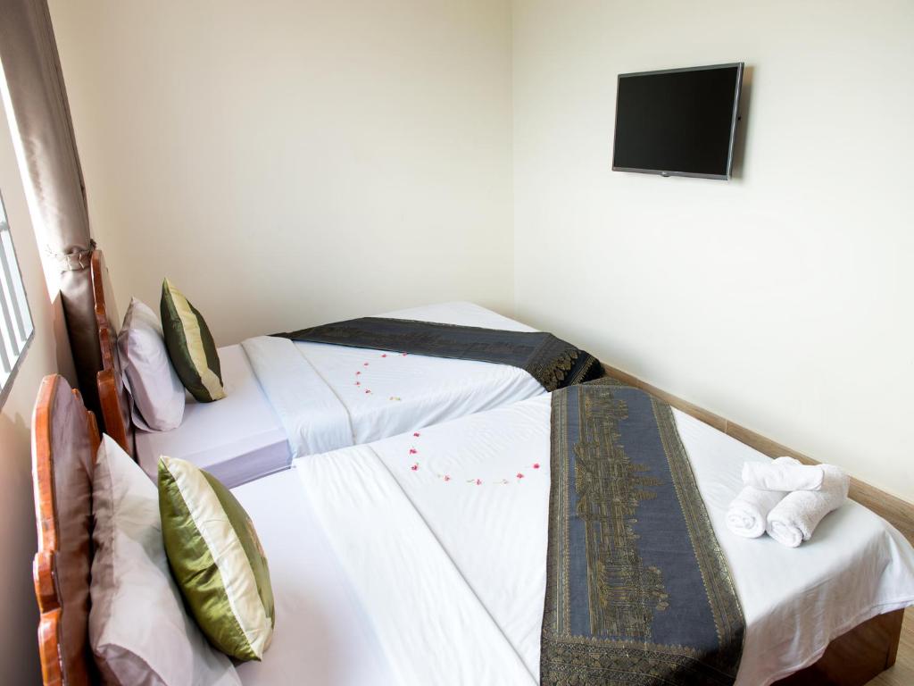 Postel nebo postele na pokoji v ubytování Dynsey Boutique Hotel
