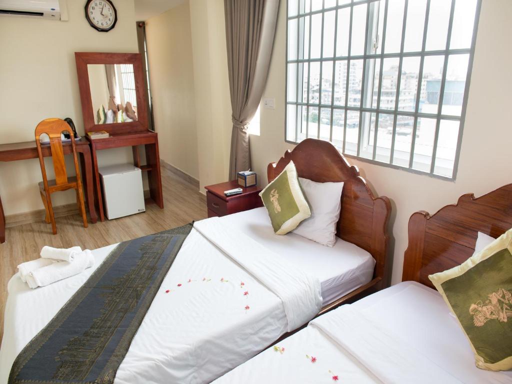 Postel nebo postele na pokoji v ubytování Dynsey Boutique Hotel