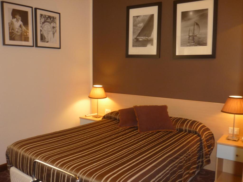 Postel nebo postele na pokoji v ubytování Hotel Ancora Riviera
