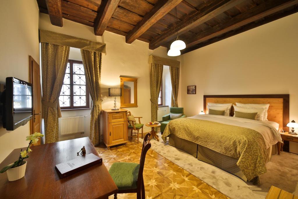 Postel nebo postele na pokoji v ubytování Questenberg Hotel