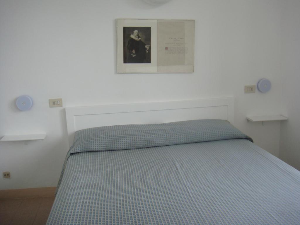 Postel nebo postele na pokoji v ubytování Hotel Meublè Agavi