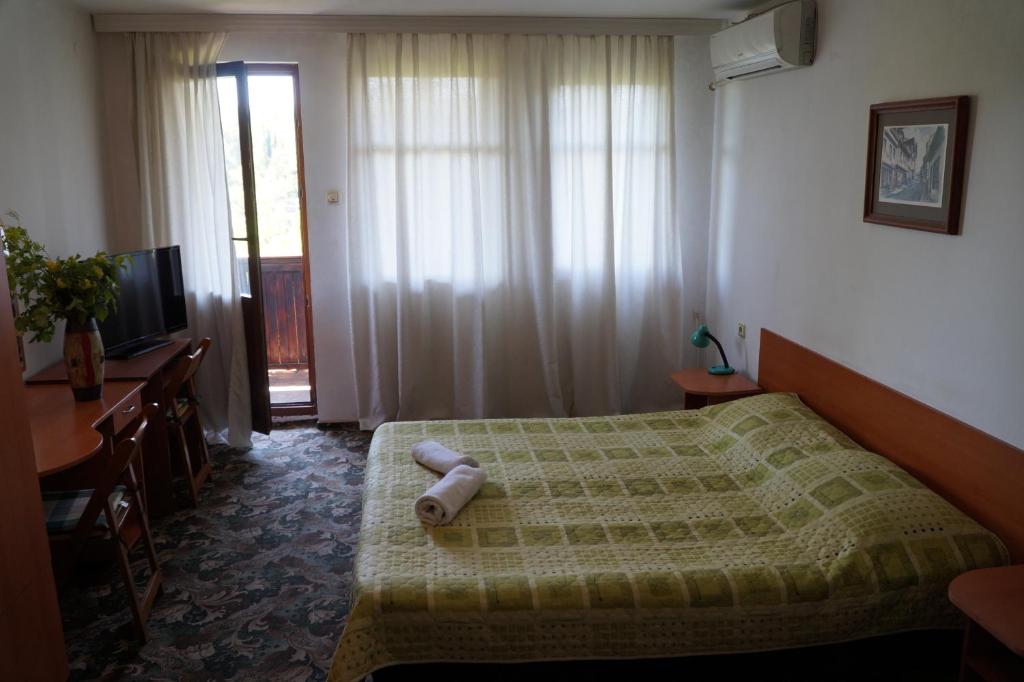 Postel nebo postele na pokoji v ubytování Guestrooms Ross