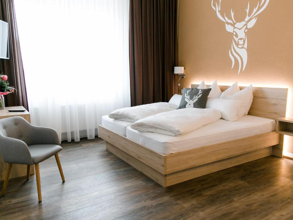 מיטה או מיטות בחדר ב-Schlemmerhütte - Hotel