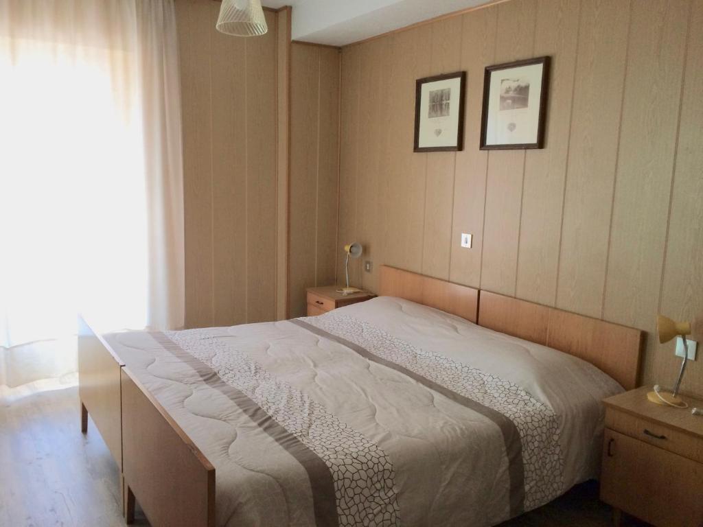 Postel nebo postele na pokoji v ubytování Garnì Serena