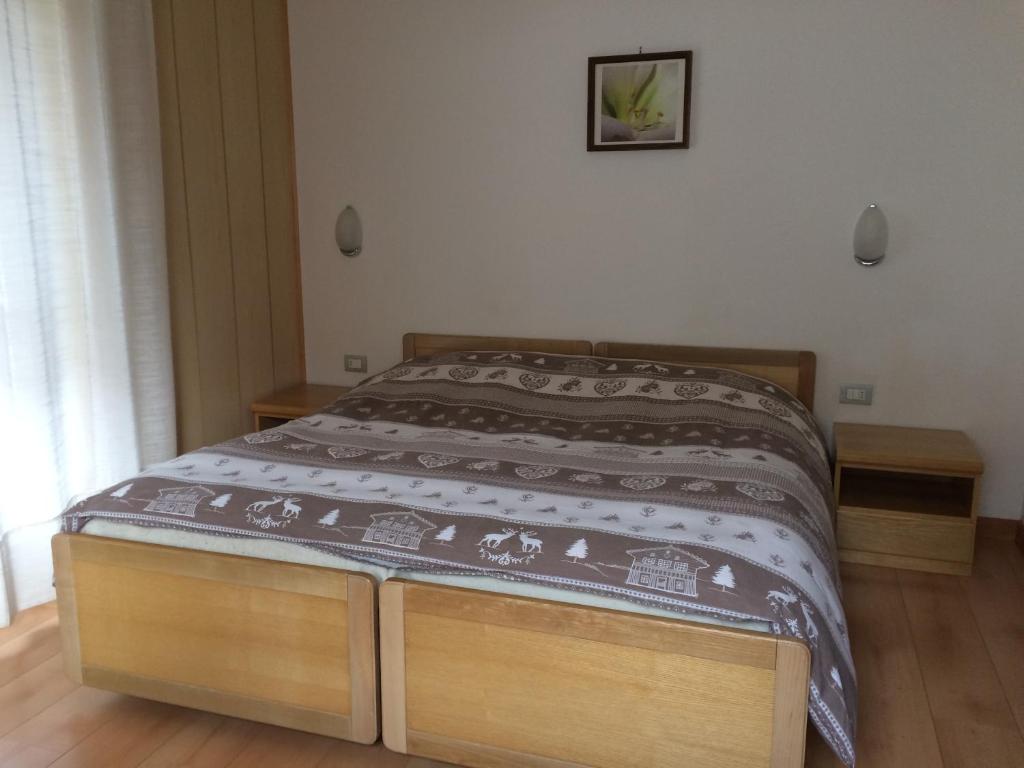 Postel nebo postele na pokoji v ubytování Garnì Serena