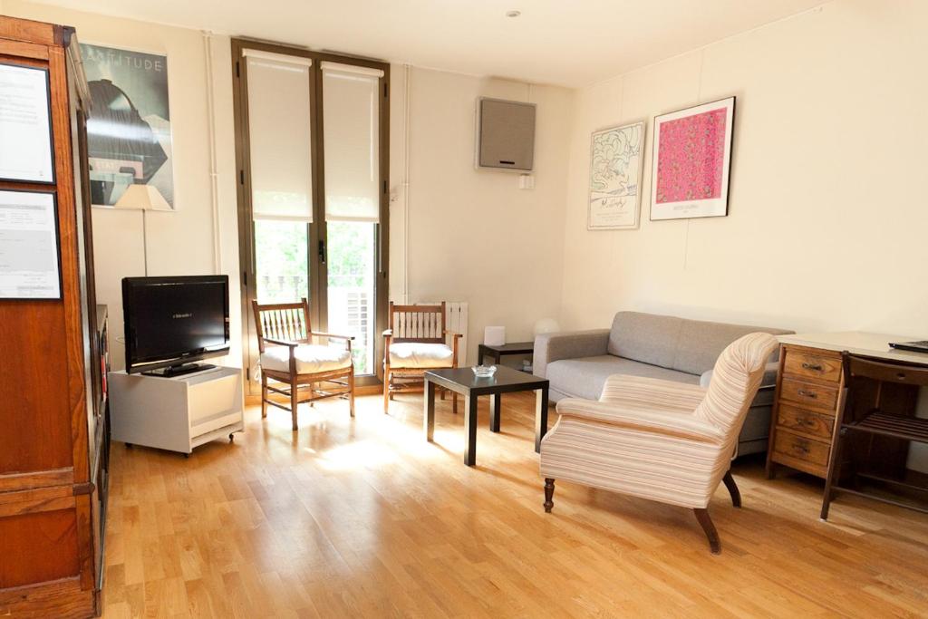 Televízia a/alebo spoločenská miestnosť v ubytovaní Penthouse Vallespir