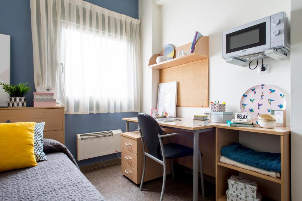 TV a/nebo společenská místnost v ubytování Residencia Universitaria Resa As Burgas