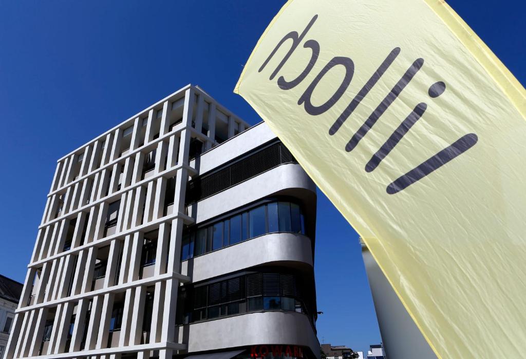 a tall building with the word roku in front of it at Exklusive Ferienwohnung Villach City in Villach