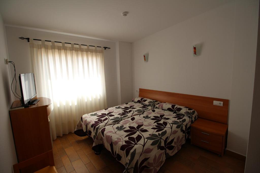 Postel nebo postele na pokoji v ubytování Hostal Nueva Tabarca