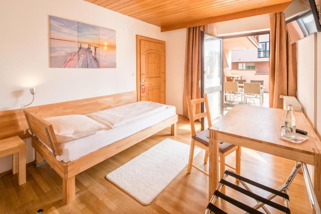 Postel nebo postele na pokoji v ubytování Hotel Bettstadl