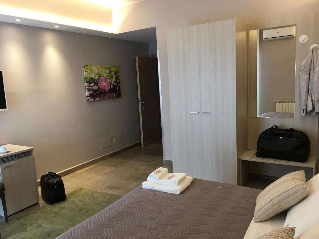 Postel nebo postele na pokoji v ubytování Alludo Aparthotel b&b
