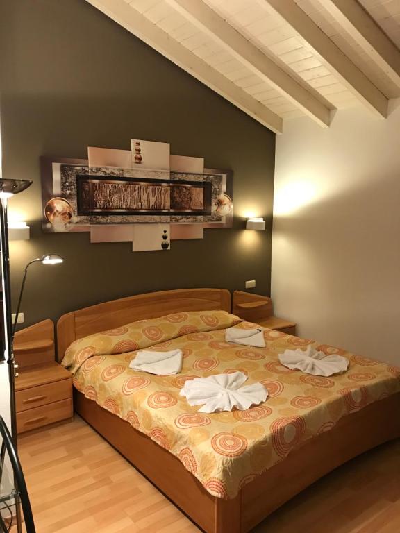 Postel nebo postele na pokoji v ubytování Hotel Korfu